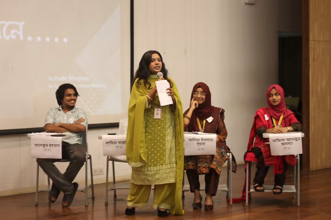Audience and faculty members at the debate