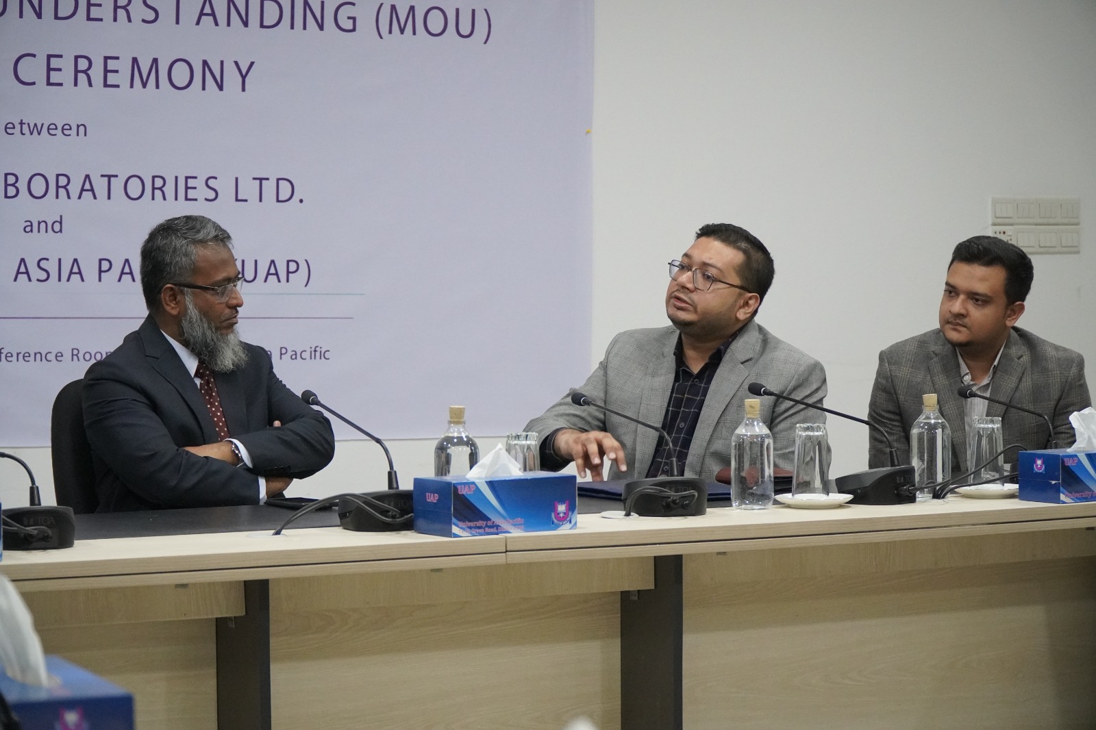 UAP and ACME Laboratories representatives at the signing table
