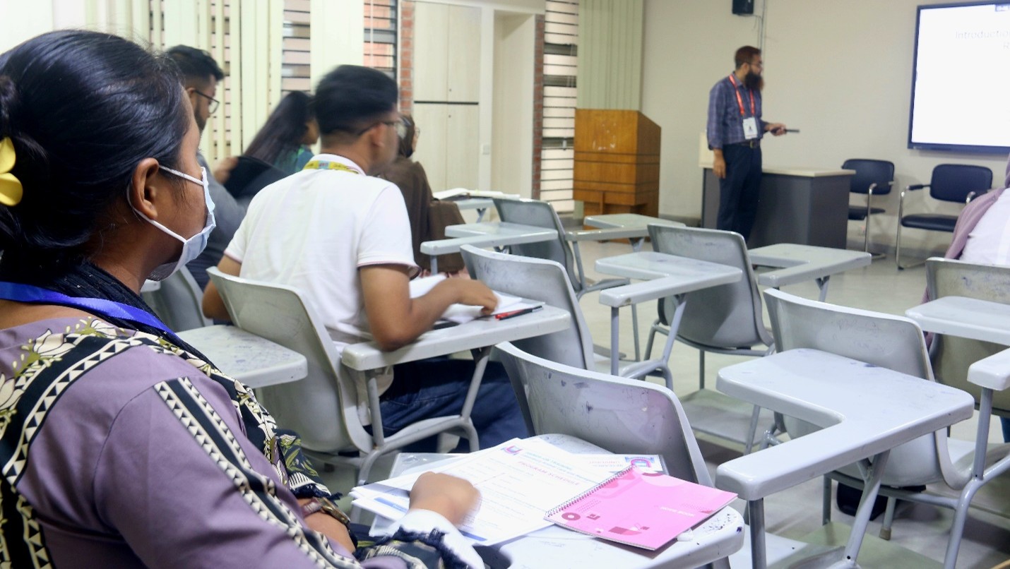 Participants engaged in hands-on animal handling session